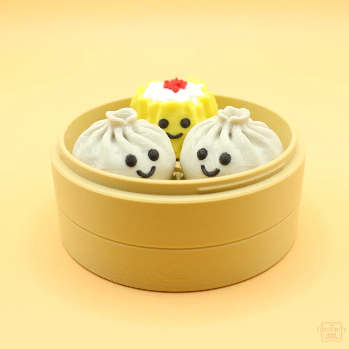 3D printed dim sum clicker dumplings and siu mai in a steamer basket