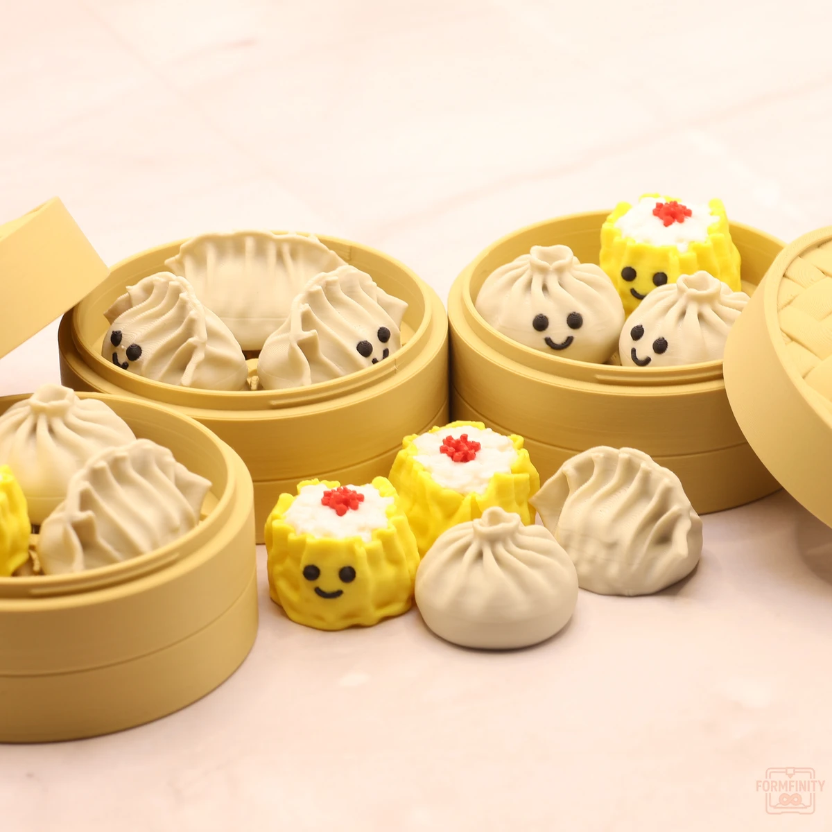 3D printed dim sum clicker dumplings and siu mai in three steamer baskets