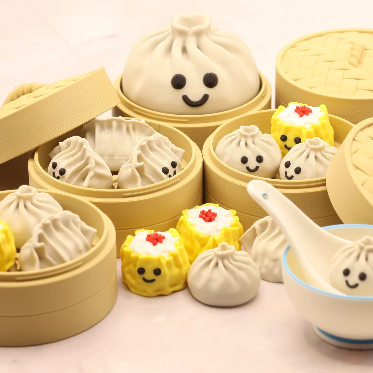 3D printed dumpling family - smiling bao, siu mai and gyoza clickers in bamboo steamer baskets