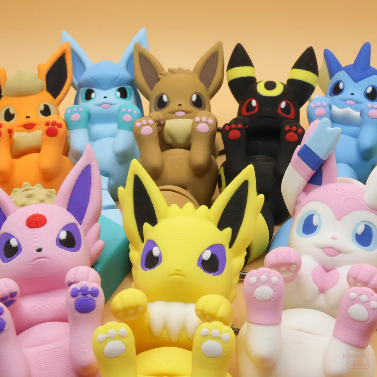 Full line-up of 3D printed Eeveelution flexi articulated keychains
