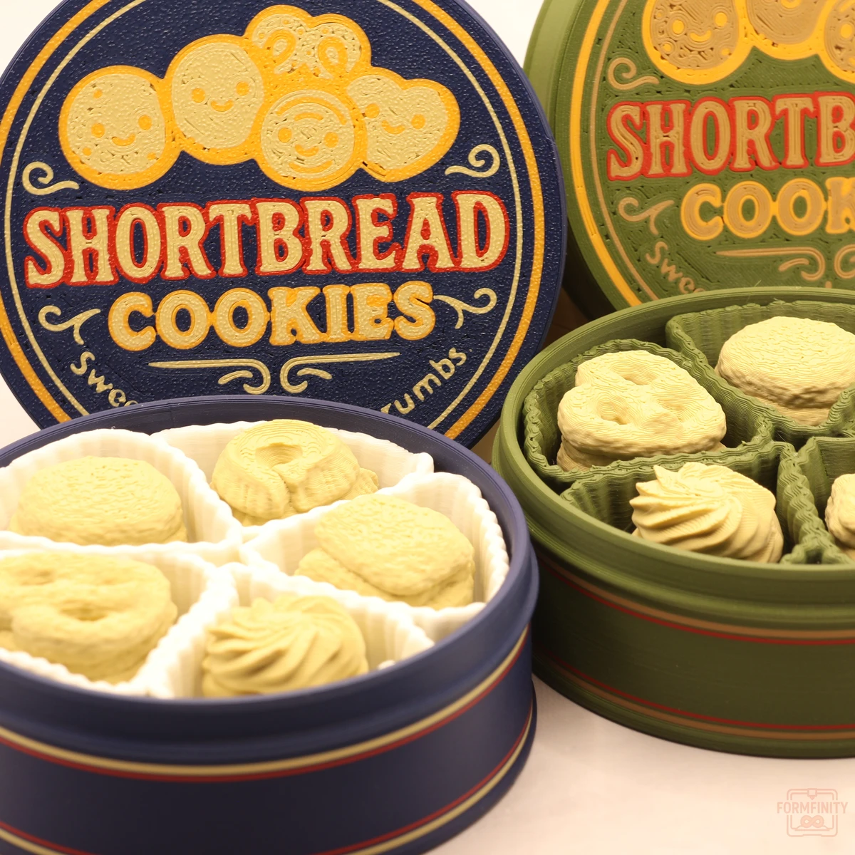 Close-up inside two 3D printed shortbread cookie tins full of clickable cookies